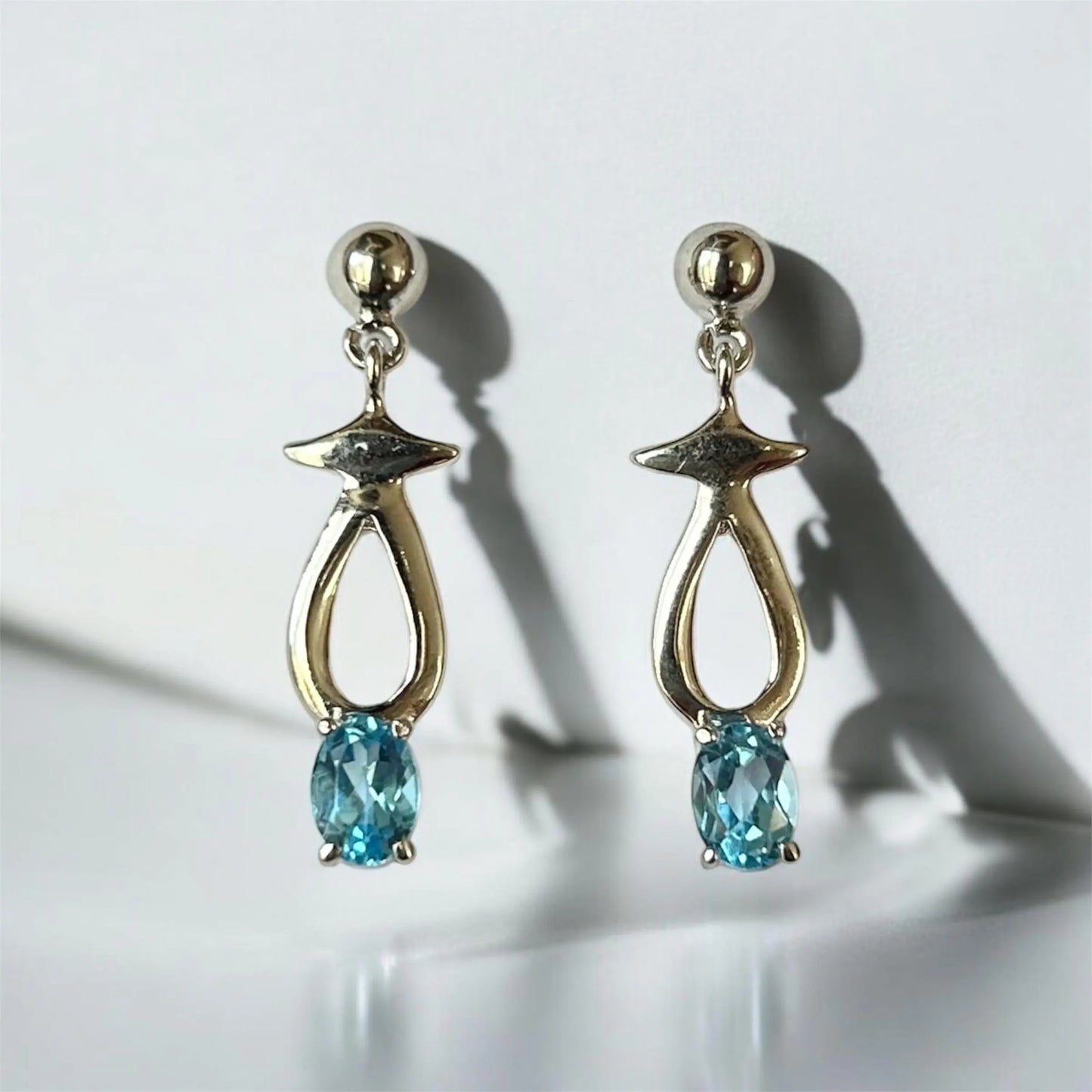 Ocean Spark Blue Topaz Teardrop Silver Earrings