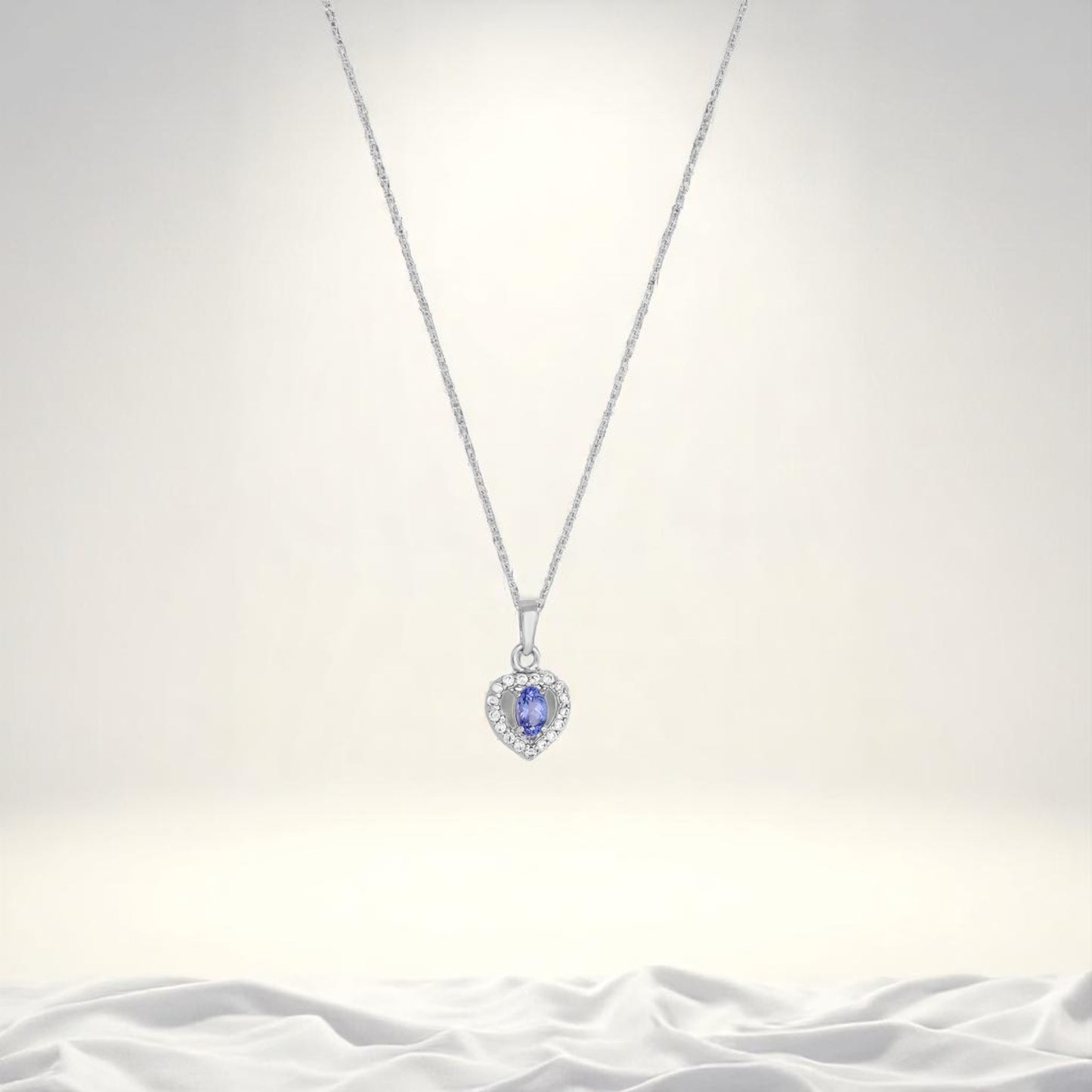 Heart-Shaped Sterling Silver Pendant with Blue Tanzanite and Sparkling Cubic Zirconia