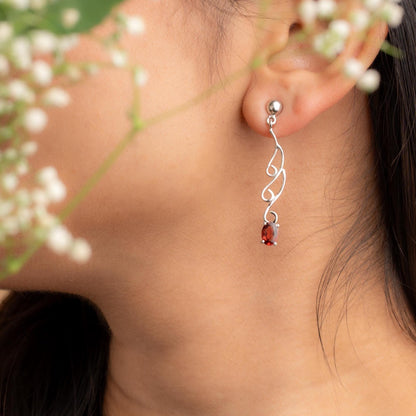 Elegant Swirl Drop Earrings with Garnet Gemstones