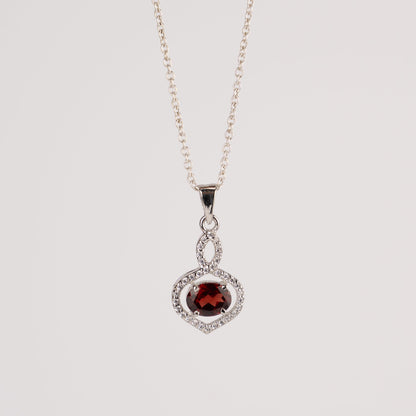Stunning Garnet / Blue Topaz in Sterling Silver with Zircon Accents