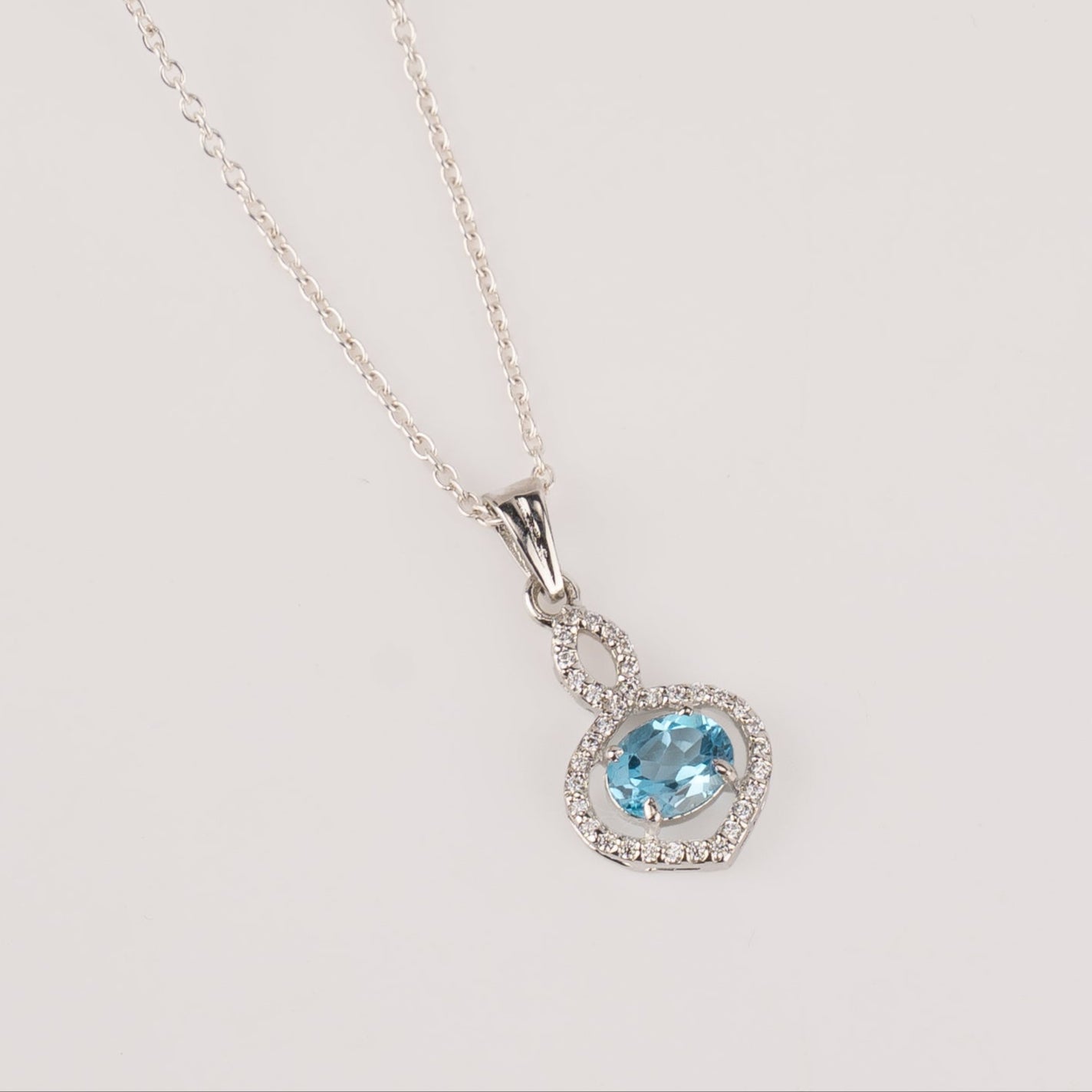 Stunning Garnet / Blue Topaz in Sterling Silver with Zircon Accents