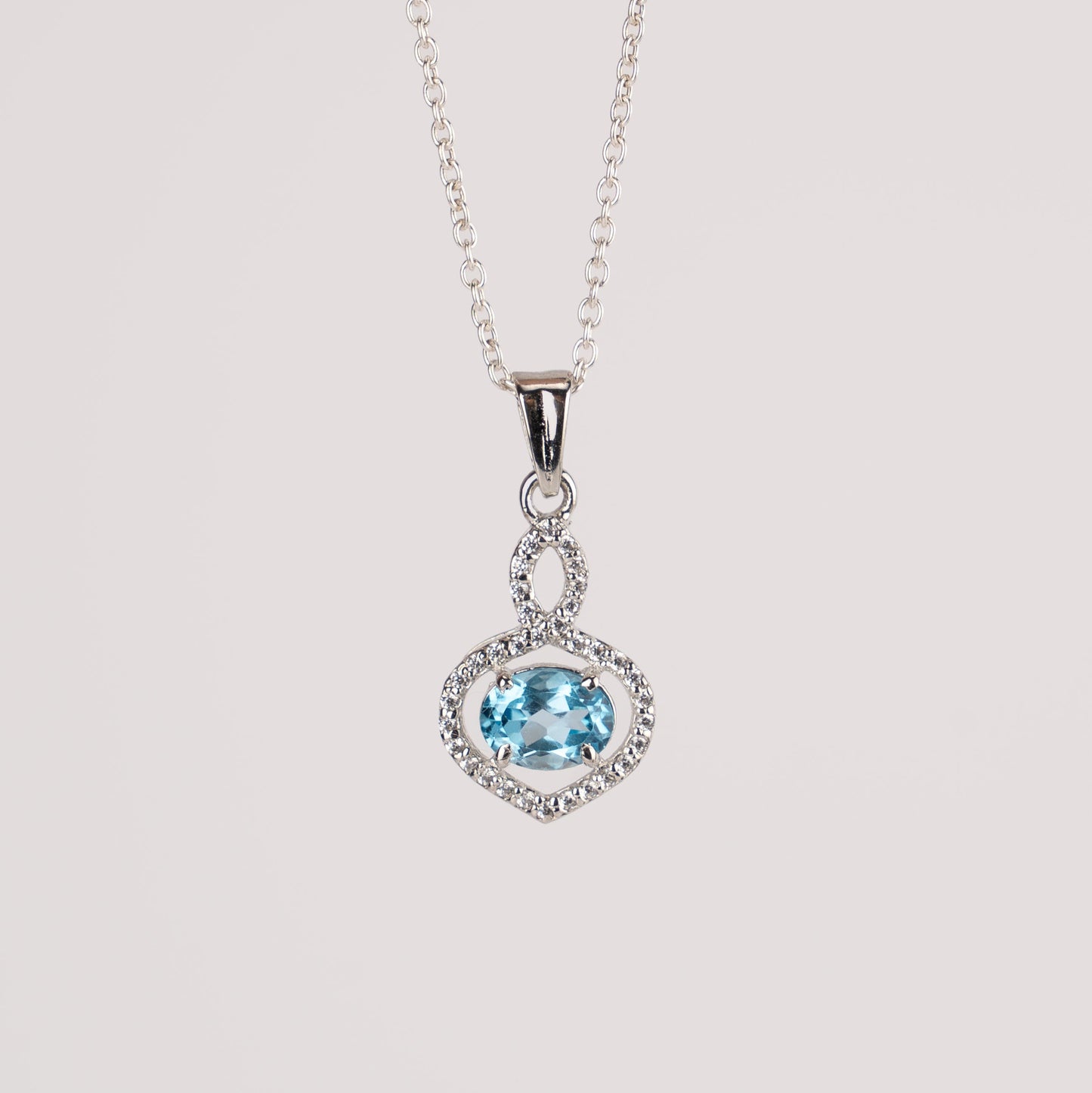 Stunning Garnet / Blue Topaz in Sterling Silver with Zircon Accents